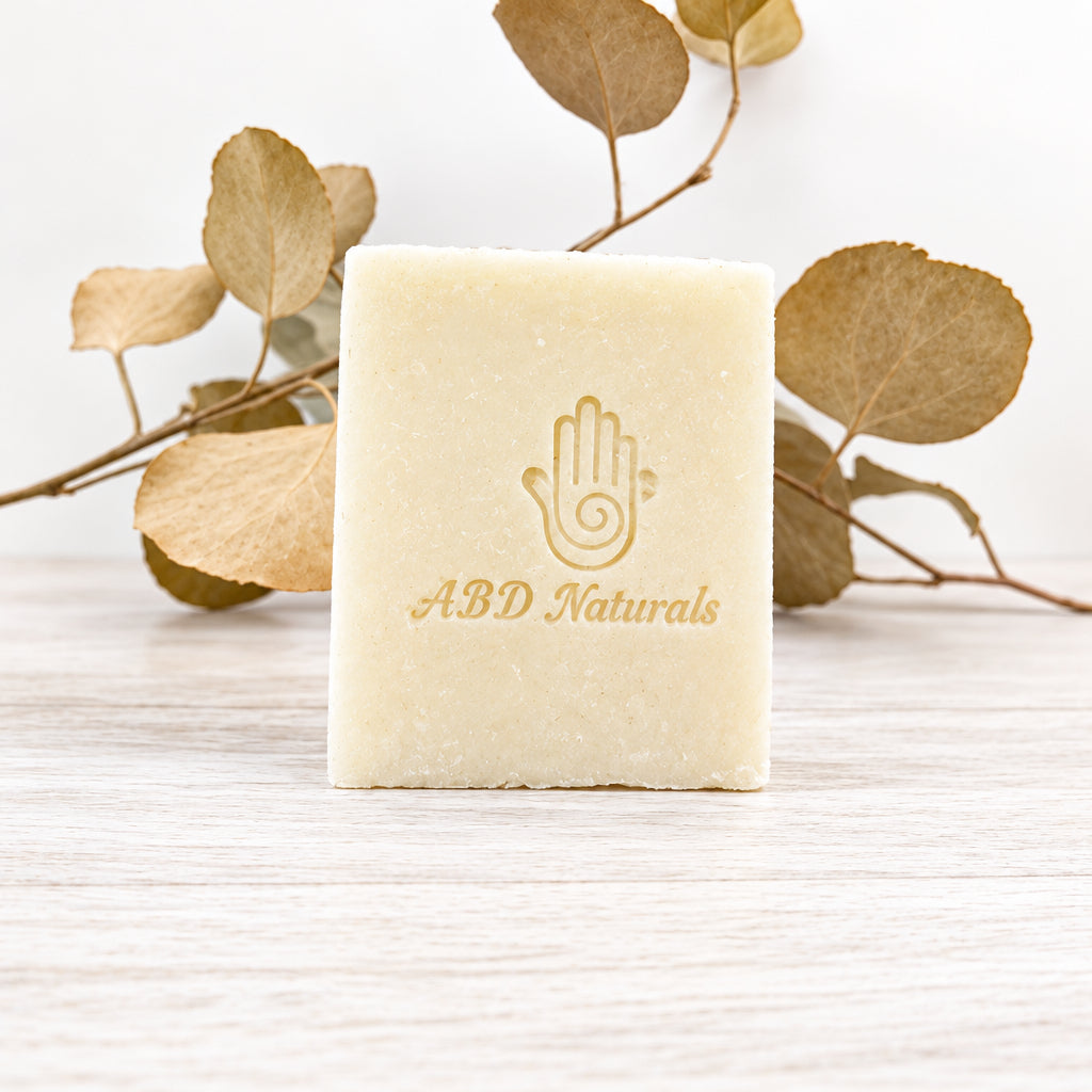 Natural stain remover soap by ABD Naturals, used for removing tough stains from clothes and fabrics
